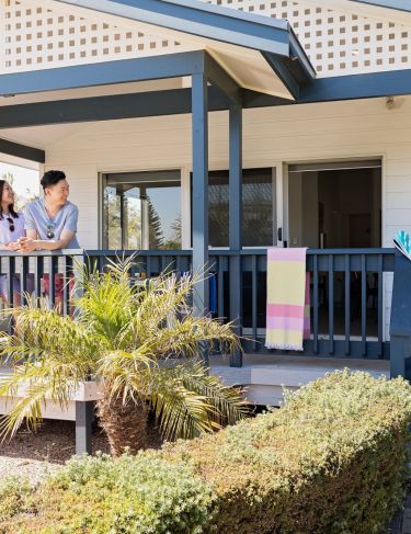 West Beach Parks Resort - Bungalow Family enjoying Deck area